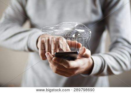 Man Hand Phone And Car Model In Screen