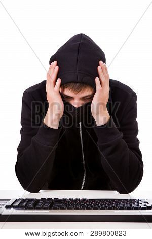 Troubled Hacker With A Computer Keyboard On The White Background