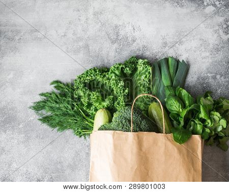 Healthy Green Vegan Ingredients For Cooking. Various Clean Green Vegetables And Herbs In Paper Bag O