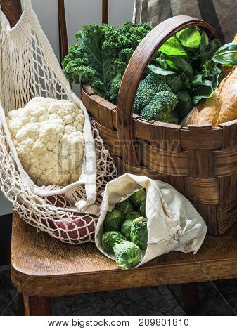 Healthy Vegetarian Ingredients For Cooking. Various Vegetables, Herbs, Nut And Bread In Basket On Wo