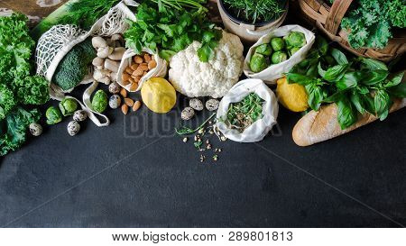 Healthy Vegetarian Ingredients For Cooking. Various Clean Vegetables, Herbs, Nut And Bread On Black 