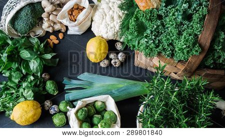 Healthy Vegetarian Ingredients For Cooking. Various Clean Vegetables, Herbs, Nut And Bread On Black 
