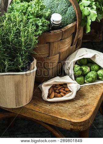 Healthy Vegetarian Ingredients For Cooking. Various Clean Vegetables, Herbs, Nut And Bread In Basket