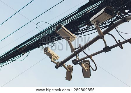 Security Cctv Camera Is Installed In Three Directions At Post With Many Cables.clutter Of Wires.non-