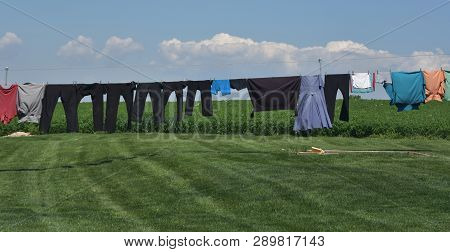Lancaster County With Mennonite Clothing On A Laundry Line Drying.