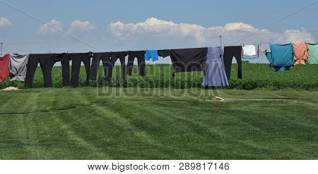 Mennonite Clothing Hanging On A Clothesline To Dry.