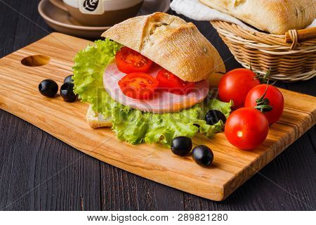 Panini Sandwiches With Fresh Tomatoes And Mozzarella And Prosciutto Ham