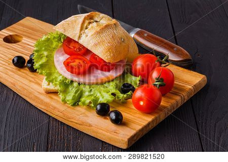 Panini Sandwiches With Fresh Tomatoes And Mozzarella And Prosciutto Ham, Italian Cuisine