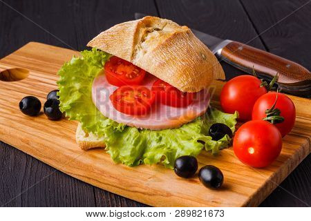 Panini With Fresh Tomatoes And Mozzarella And Prosciutto Ham, Italian Cuisine Slicing Board