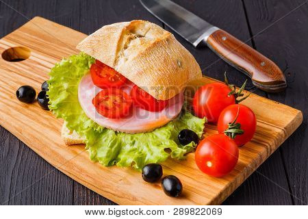 Panini Sandwiches With Fresh Tomatoes And Mozzarella And Prosciutto Ham