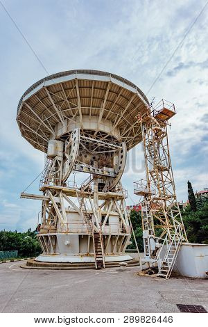 Old Rusty Abandoned Radio Telescope Satellite Dish.