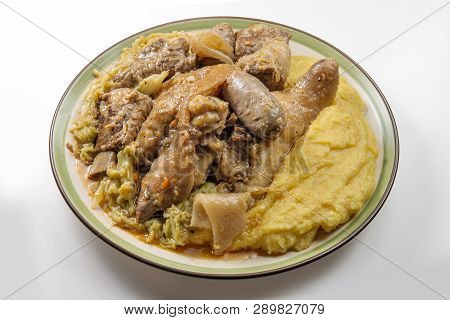Plate With Pork Meat And Savoy Cabbage And Polenta