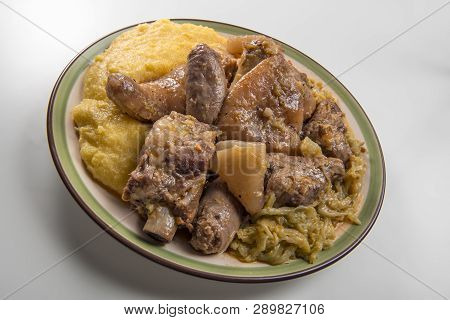 Plate With Pork Meat And Savoy Cabbage And Polenta