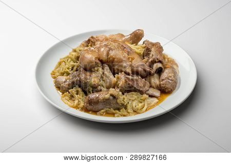 White Plate With Pork Meat And Savoy Cabbage