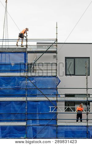 Gosford, New South Wales, Australia - February 21, 2019: Removing Scaffolding And Safety Netting On 