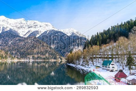 Houses On The Shore Of A Beautiful Mountain Lake