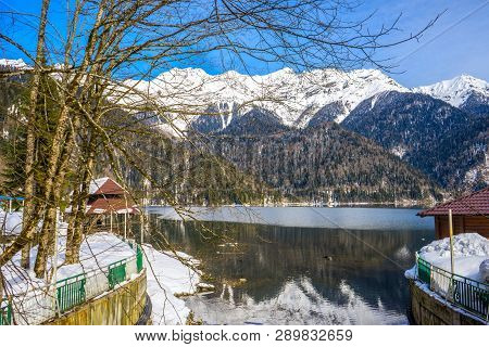 Mountains Covered With Snow On The Shore Of A Beautiful Lake
