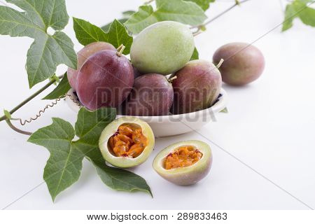 Fruits Of Gulupa On Vine Wood Table, Passiflora Pinnatistipula
