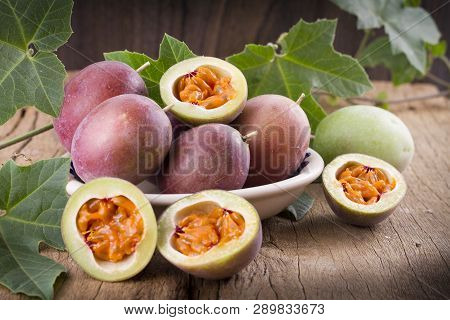 Fruits Of Gulupa On Vine Wood Table, Passiflora Pinnatistipula