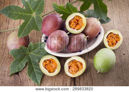 Fruits Of Gulupa On Vine Wood Table, Passiflora Pinnatistipula