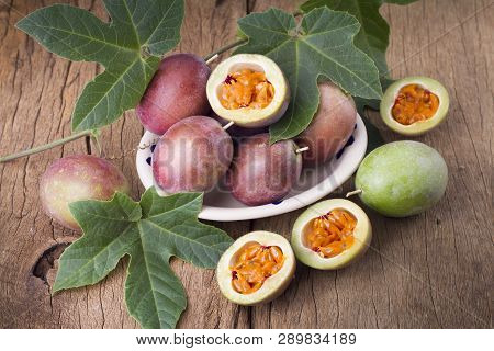 Fruits Of Gulupa On Vine Wood Table, Passiflora Pinnatistipula