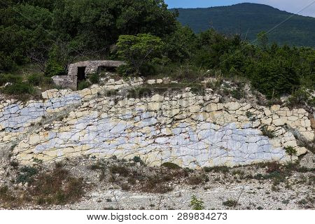 Shale Mountains Cement Pits. The Texture Of The Stone Wall. Large Stone Cracks, The Separation Of Th