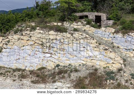 Shale Mountains Cement Pits. The Texture Of The Stone Wall. Large Stone Cracks, The Separation Of Th