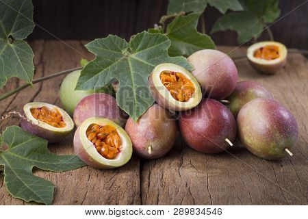 Fruits Of Gulupa On Vine Wood Table, Passiflora Pinnatistipula