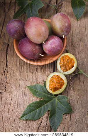 Fruits Of Gulupa On Vine Wood Table, Passiflora Pinnatistipula