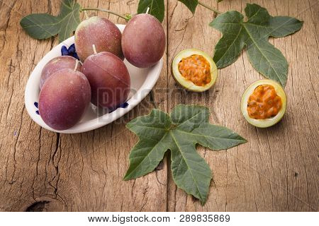 Fruits Of Gulupa On Vine Wood Table, Passiflora Pinnatistipula