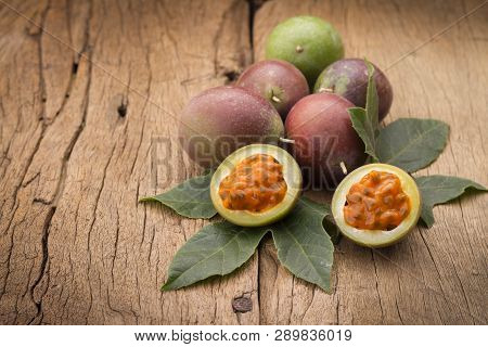 Fruits Of Gulupa On Vine Wood Table, Passiflora Pinnatistipula