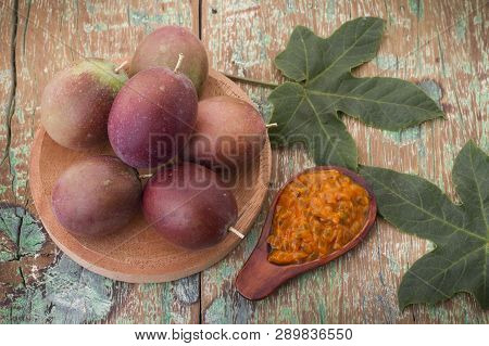 Fruits Of Gulupa On Vine Wood Table, Passiflora Pinnatistipula