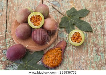 Fruits Of Gulupa On Vine Wood Table, Passiflora Pinnatistipula