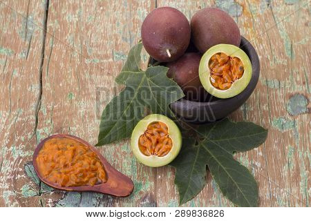 Fruits Of Gulupa On Vine Wood Table, Passiflora Pinnatistipula