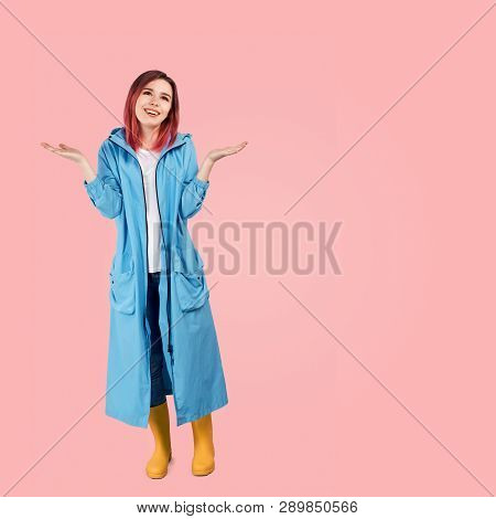 A Pretty Girl Smiles Widely And Spreads Her Hands Palms Up In Anticipation Of The Beautiful Weather 