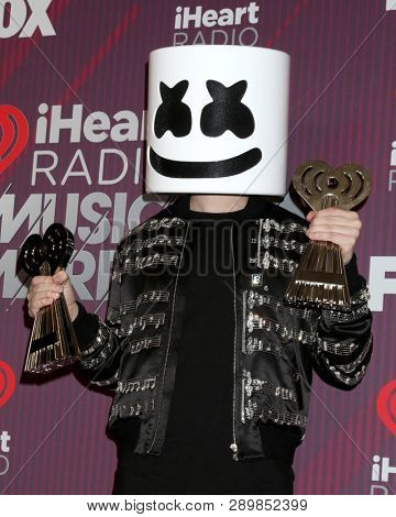 LOS ANGELES - MAR 14:  Marshmello, Christopher Comstock at the iHeart Radio Music Awards - Press Room at the Microsoft Theater on March 14, 2019 in Los Angeles, CA