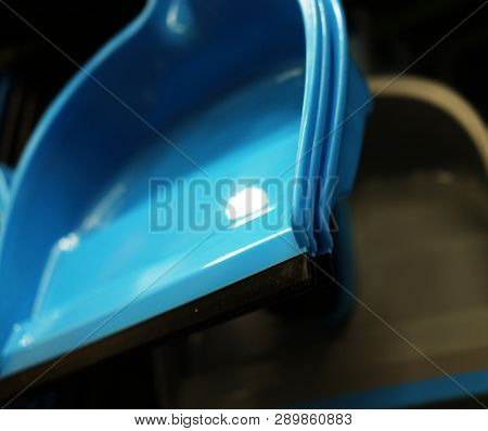 Plastic household  scoops in store, close up