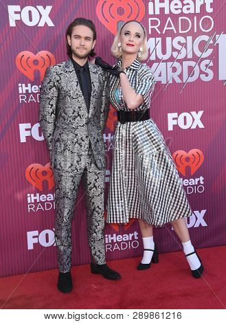 LOS ANGELES - MAR 14:  Zedd and Katy Perry arrives for the iHeart Radio Music Awards 2019 on March 14, 2019 in Los Angeles, CA