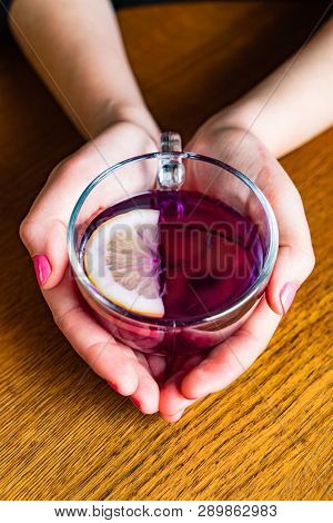 woman drinking Blue Butterfly Pea Tea