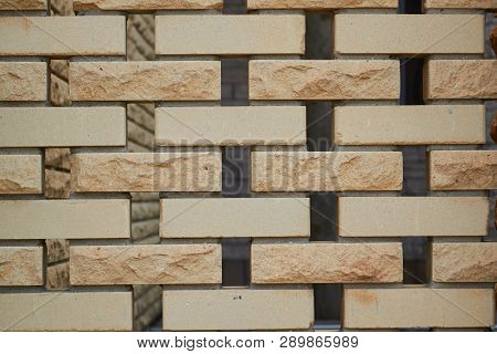 Sandstone Brick Wall Texture Background With Hole Between Briks