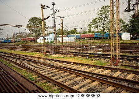 Railway Tracks Lies Together. An Old Rail Coach Gathered Beside The Rail Tracks.