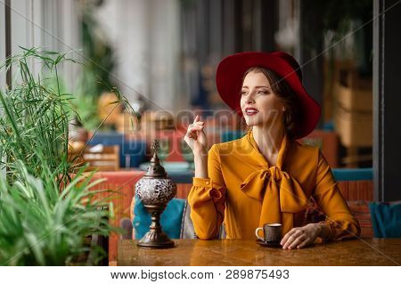 Portrait Of Sensual Young Girl Wearing Floppy Hat And Blouse With Bow. Beautiful Brunette Woman In C