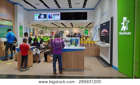 Singapore- 14 Mar, 2019: Customers Visit Starhub Retail Shop In Singapore. Starhub Ltd Is One Of The