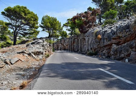 Open Coastal Road Winding Through To Lighthouse Cap Formentor