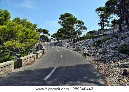 Open Coastal Road Winding Through To Lighthouse Cap Formentor