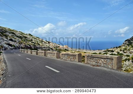 Amazing Landscape When Driving On An Open Coastal Road Winding Through To Lighthouse Cap Formentor