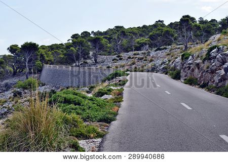 Open Coastal Road Winding Through To Lighthouse Cap Formentor