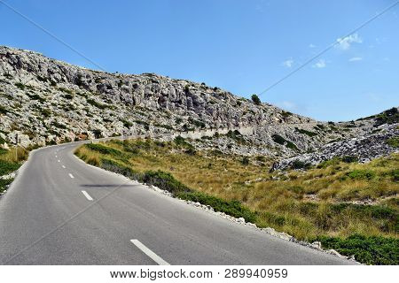Open Coastal Road Winding Through To Lighthouse Cap Formentor
