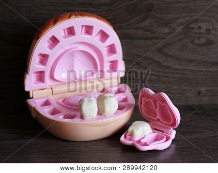 Teeth Model With Dental Tools, Toys On Wooden Background