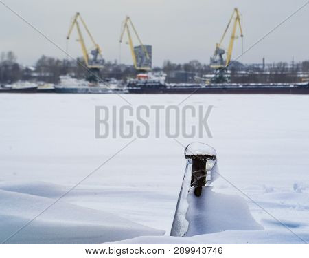 Industrial Landscape With Frozen Screw And Cranes